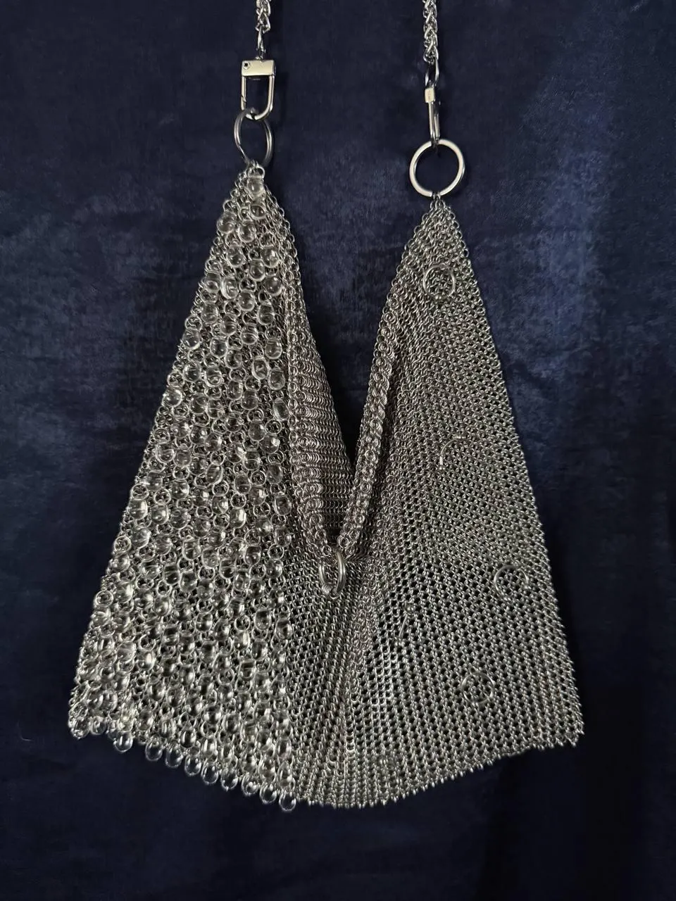Open chainmail bag showing glass beads and ring clasp