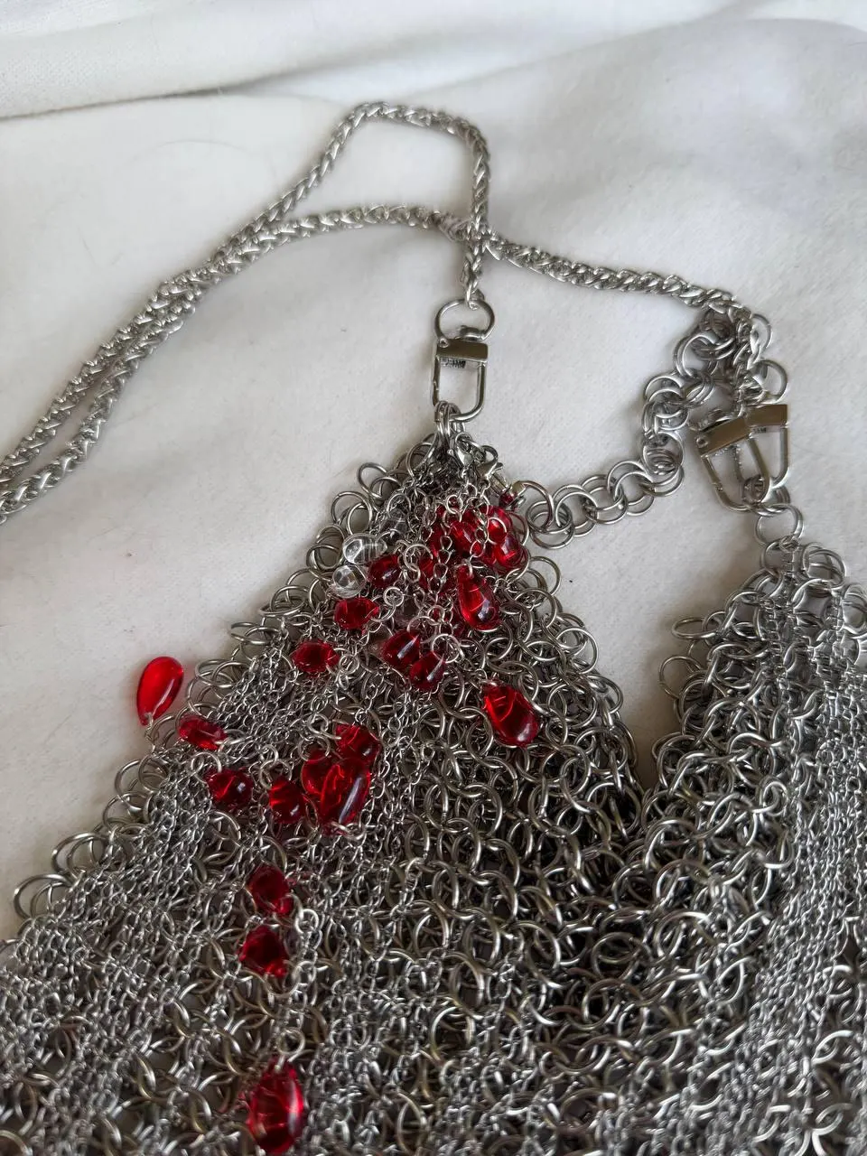 Chainmail bag with red glass drops and piercing hardware