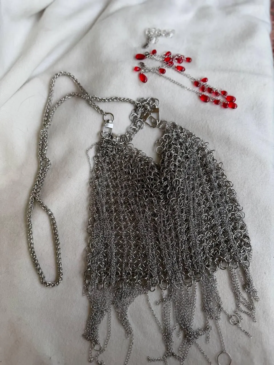 Chainmail bag with shoulder chain and red glass accessories